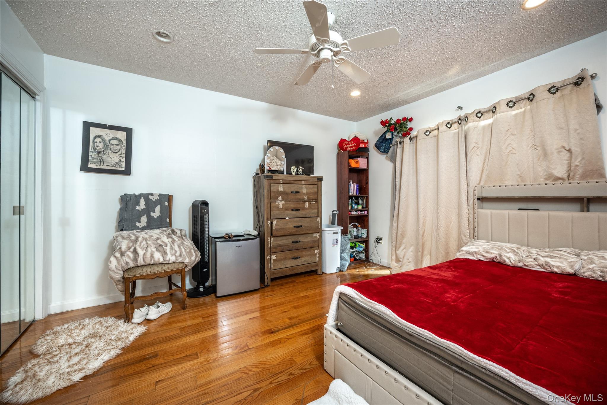 929 Fox Meadow Road Yorktown Heights, NY 10598 - Photo 15 of 32 a bedroom with a bed and a chair