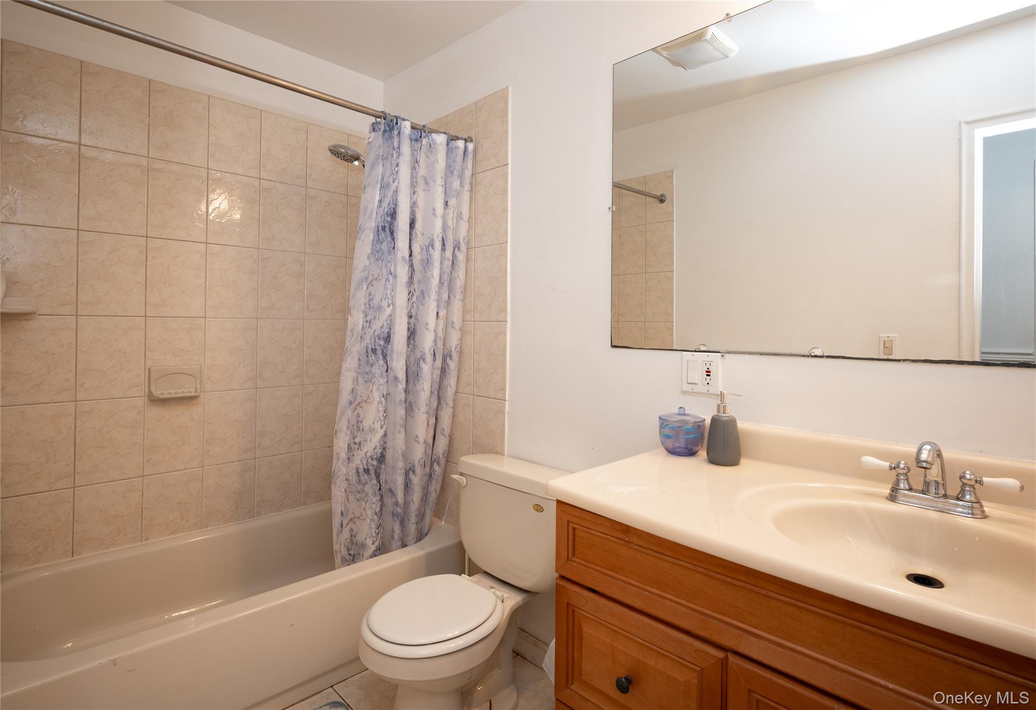 929 Fox Meadow Road Yorktown Heights, NY 10598 - Photo 18 of 32 a bathroom with a sink a toilet and shower
