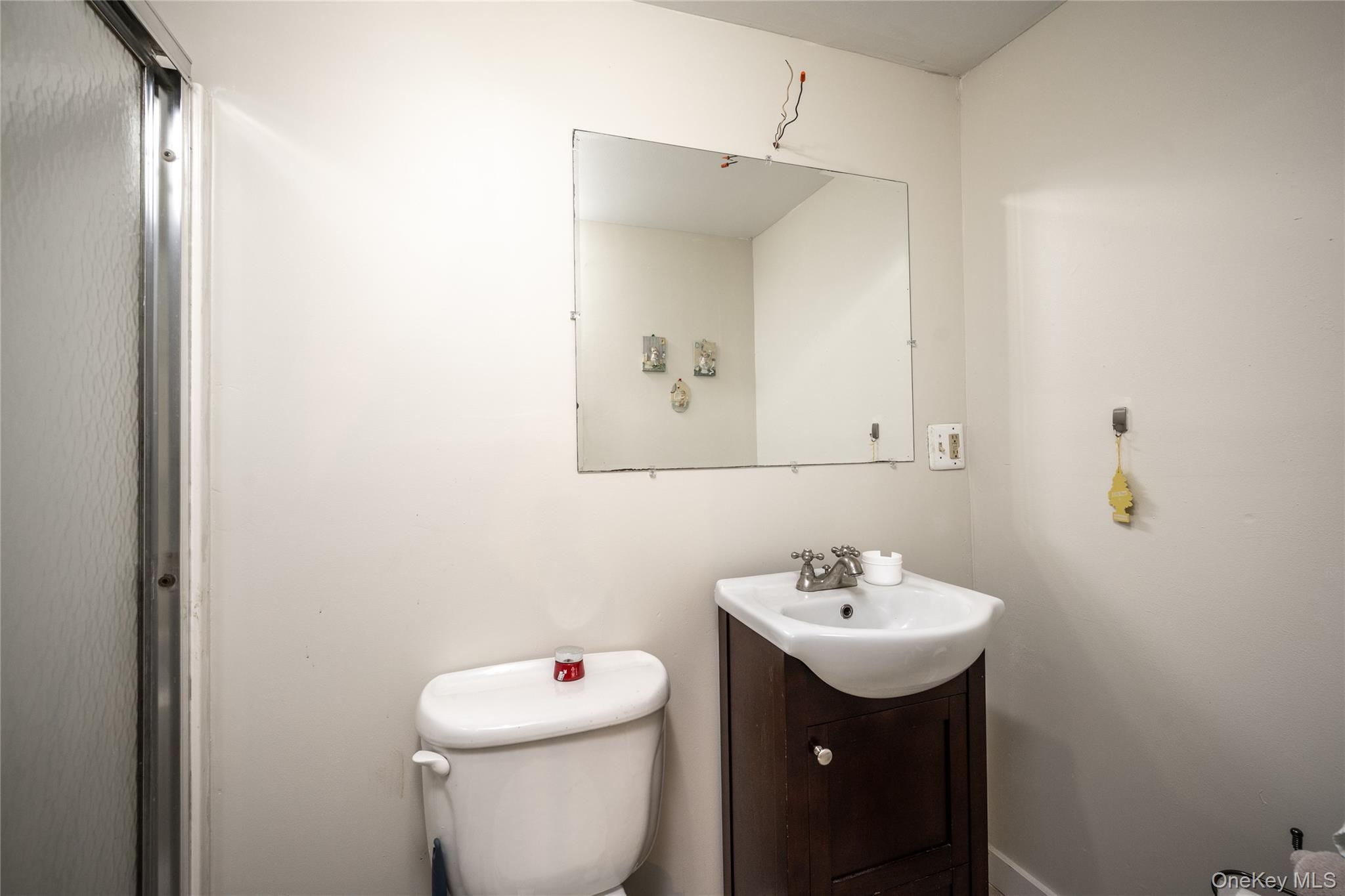929 Fox Meadow Road Yorktown Heights, NY 10598 - Photo 22 of 32 a bathroom with a sink toilet and a mirror