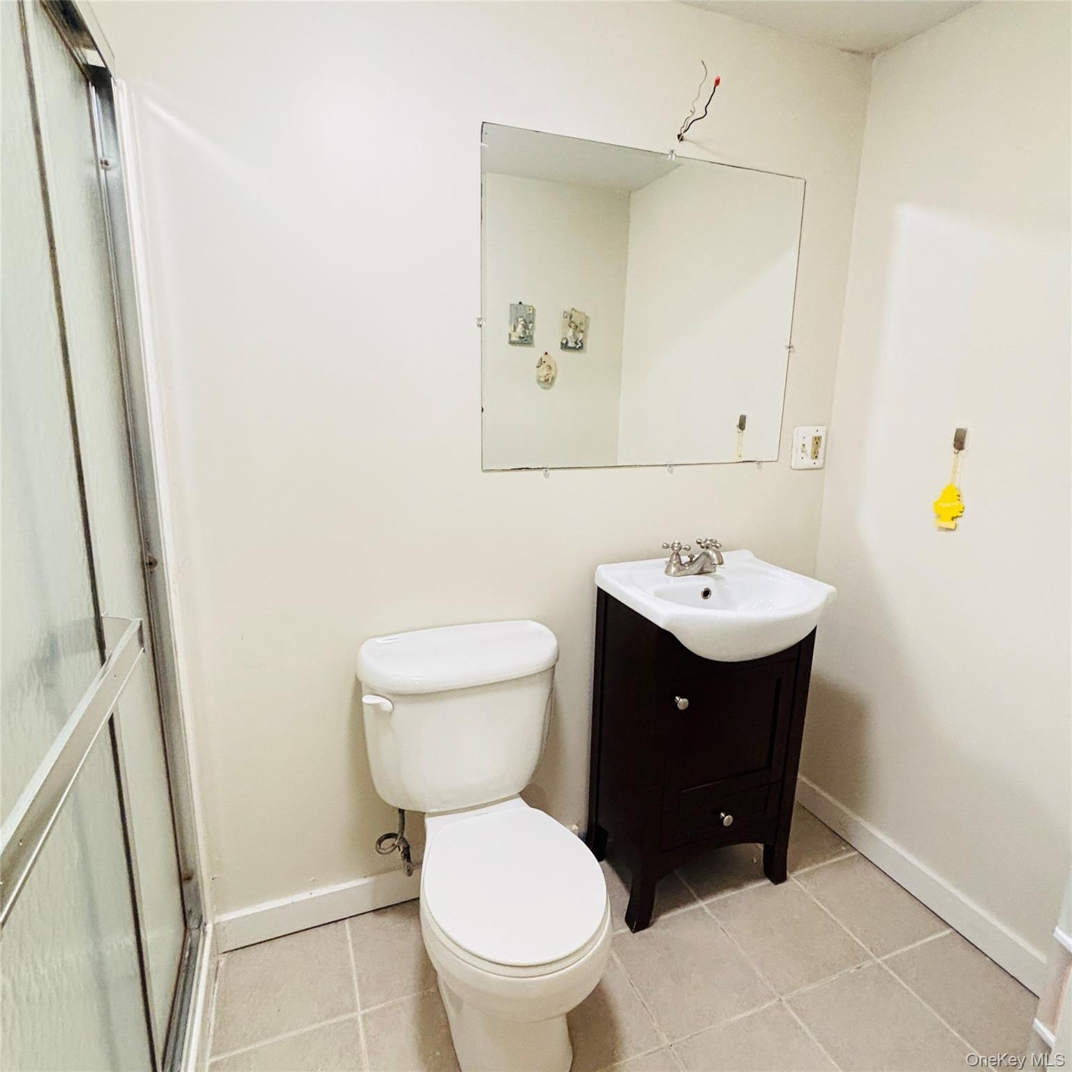 929 Fox Meadow Road Yorktown Heights, NY 10598 - Photo 30 of 41 a bathroom with a sink toilet and a mirror