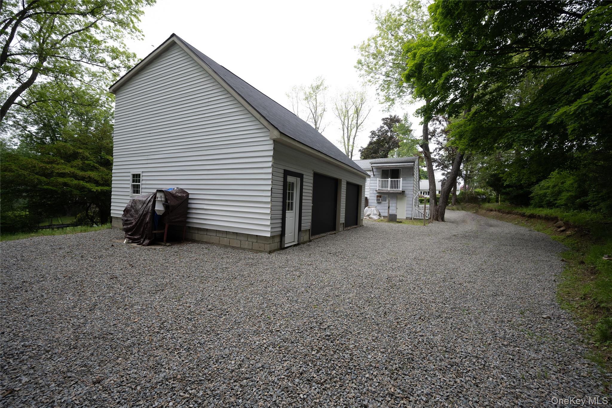 929 Fox Meadow Road Yorktown Heights, NY 10598 - Photo 3 of 32 a view of a house with backyard and a tree