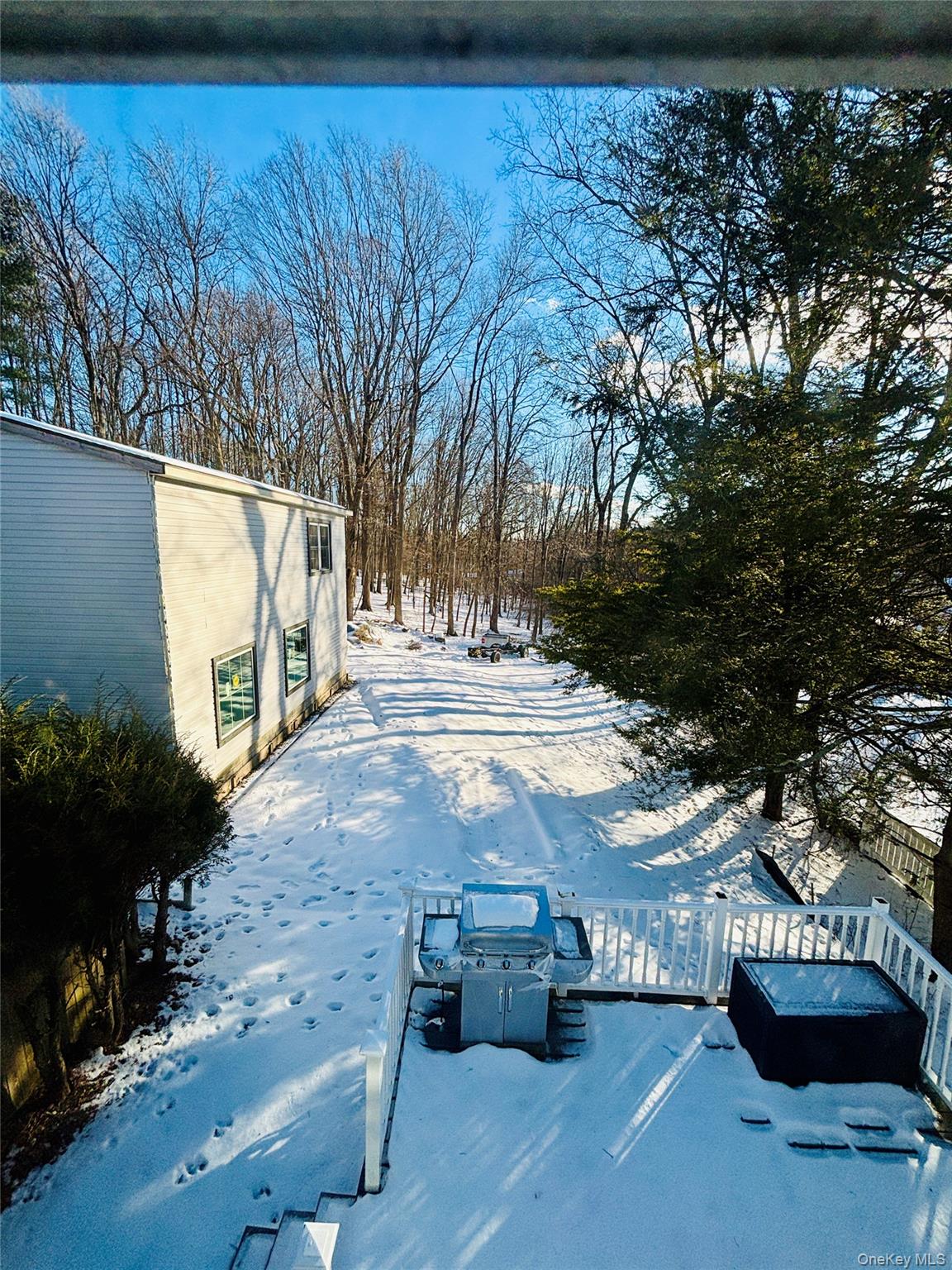 929 Fox Meadow Road Yorktown Heights, NY 10598 - Photo 33 of 41 Snowy yard with a deck