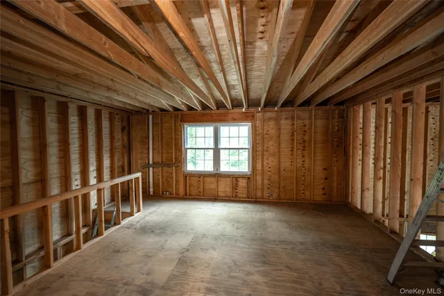 a view of entryway with wooden walls