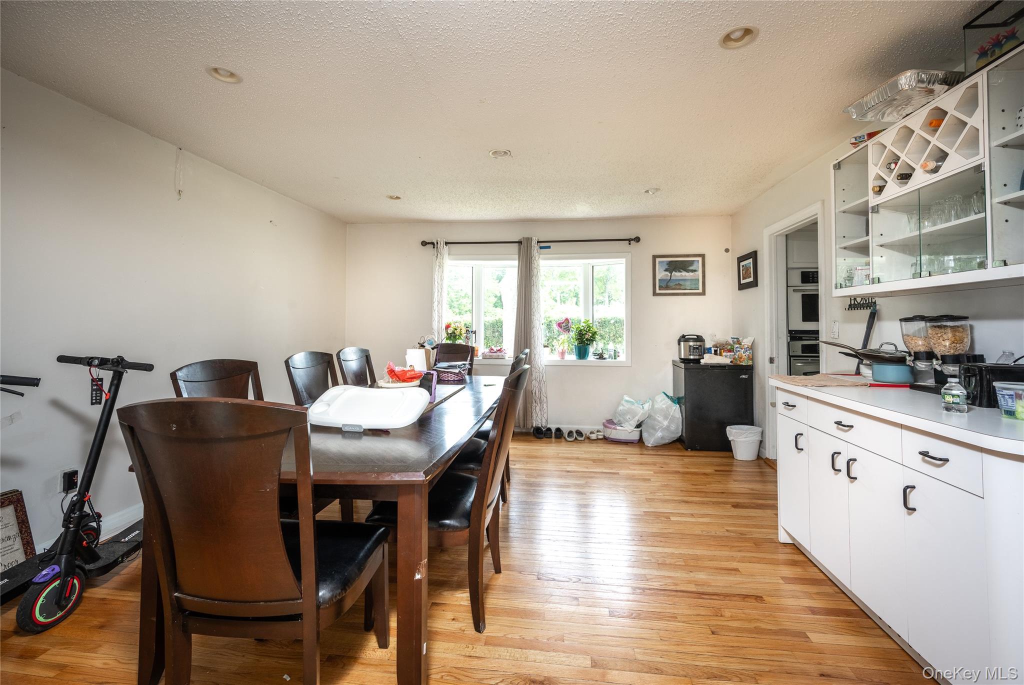 929 Fox Meadow Road Yorktown Heights, NY 10598 - Photo 6 of 32 a view of a dining room with furniture and wooden floor