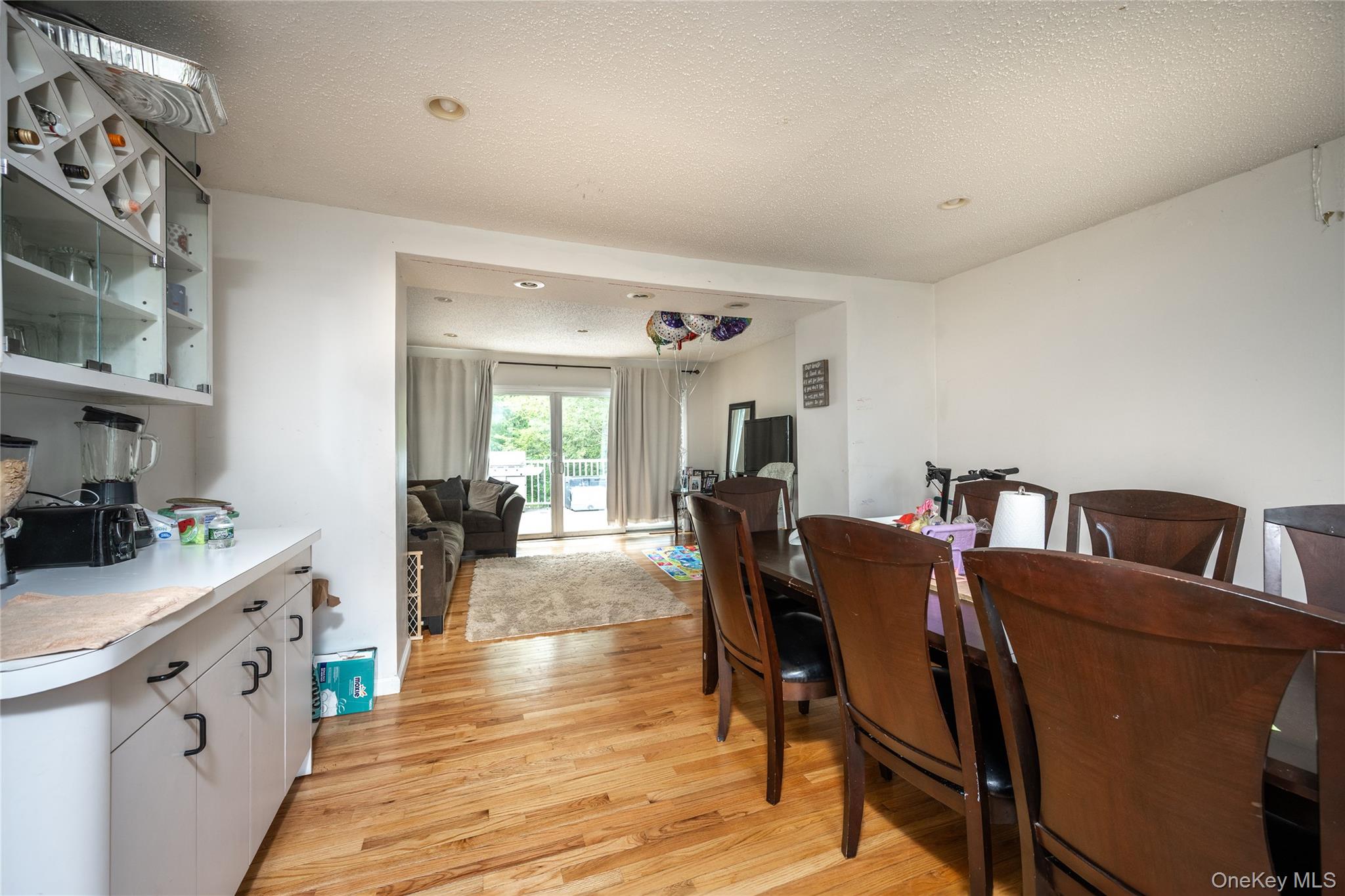 929 Fox Meadow Road Yorktown Heights, NY 10598 - Photo 8 of 32 a view of a dining room with furniture and wooden floor