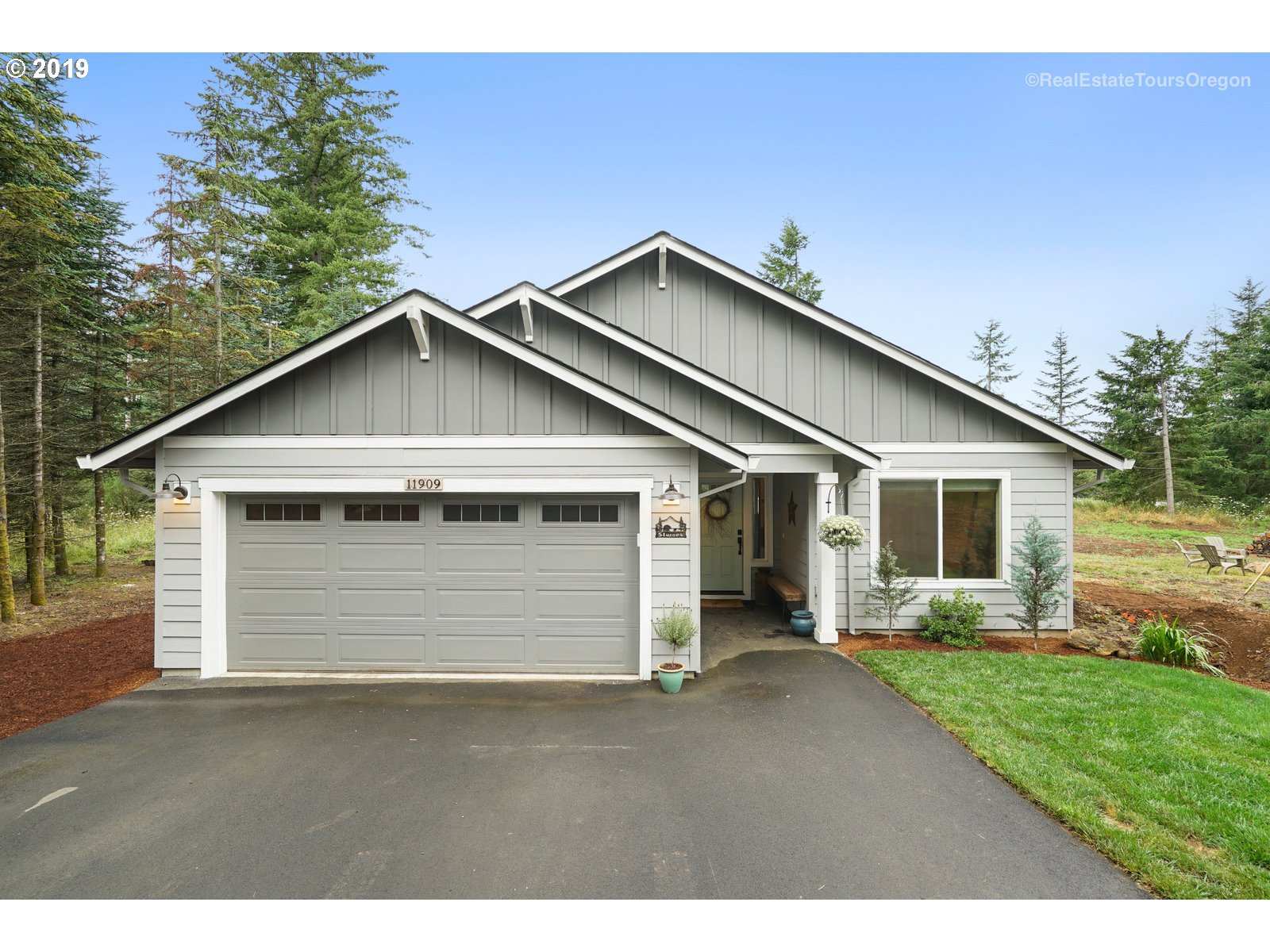 11909 Southeast Laughing Water Road Sandy, OR 97055 - Photo 1 of 22 a view of a backyard of a house