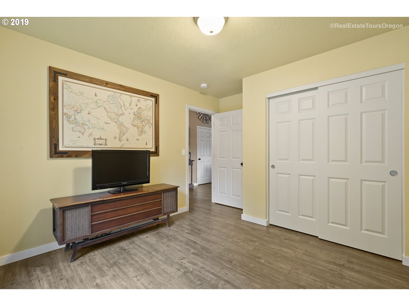 11909 Southeast Laughing Water Road Sandy, OR 97055 - Photo 13 of 22 a living room with furniture and a flat screen tv