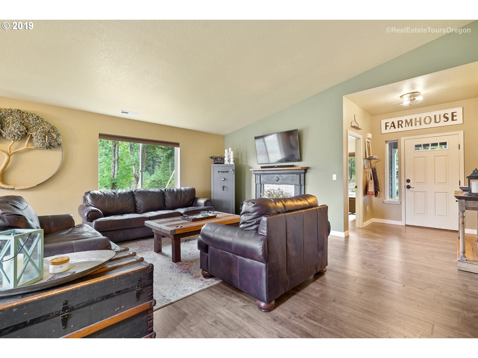11909 Southeast Laughing Water Road Sandy, OR 97055 - Photo 2 of 22 a living room with furniture and a fireplace