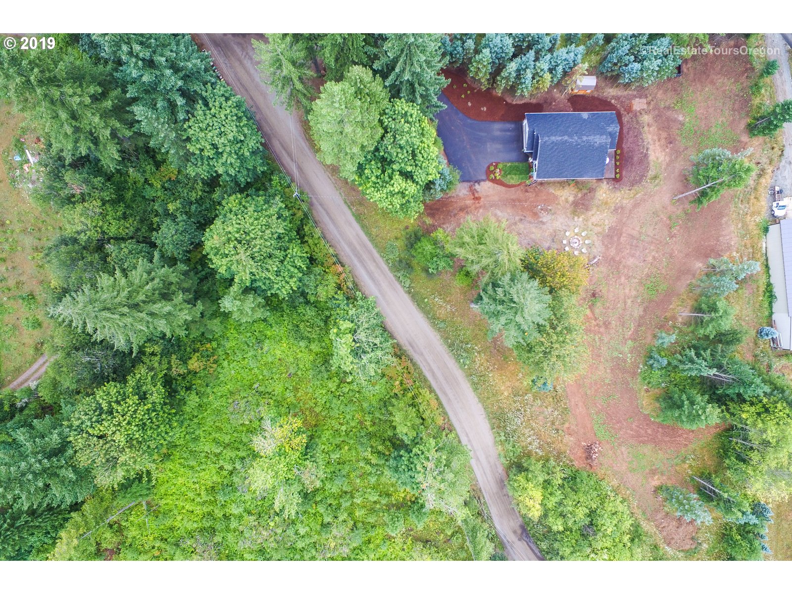 11909 Southeast Laughing Water Road Sandy, OR 97055 - Photo 21 of 22 an aerial view of a house with a yard