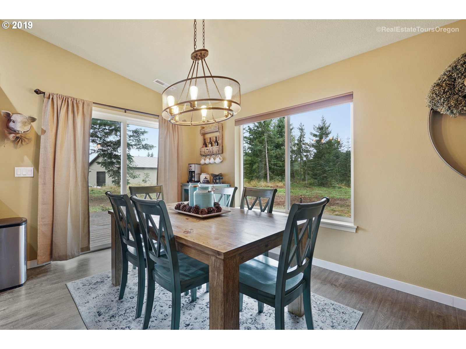 11909 Southeast Laughing Water Road Sandy, OR 97055 - Photo 5 of 22 a view of a dining room with furniture window and outside view