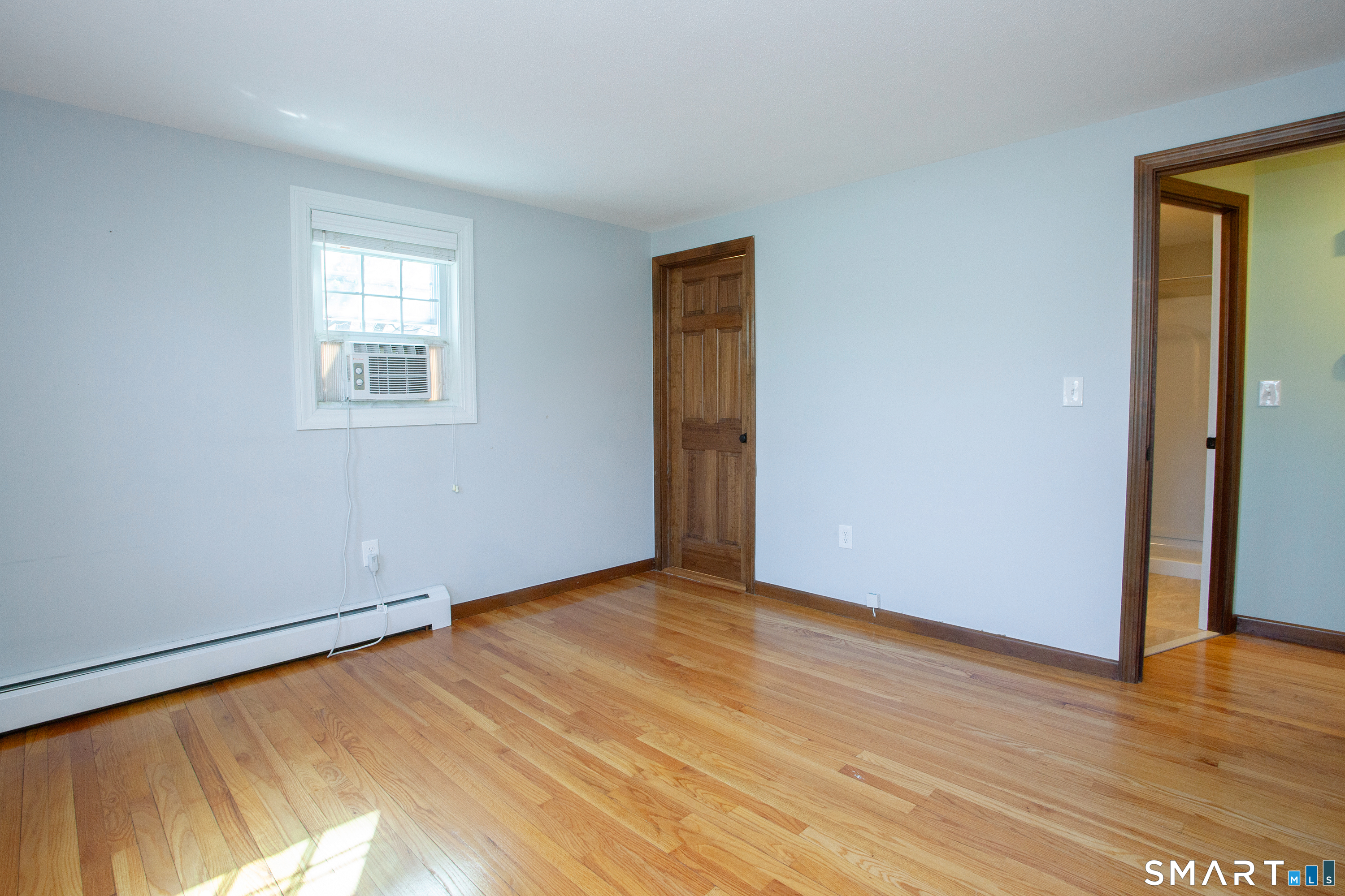 172 Weymouth Road Enfield, CT 06082 - Photo 20 of 35 In this photo, the door to the left goes into the walk in closet and the open door goes into the primary bathroom