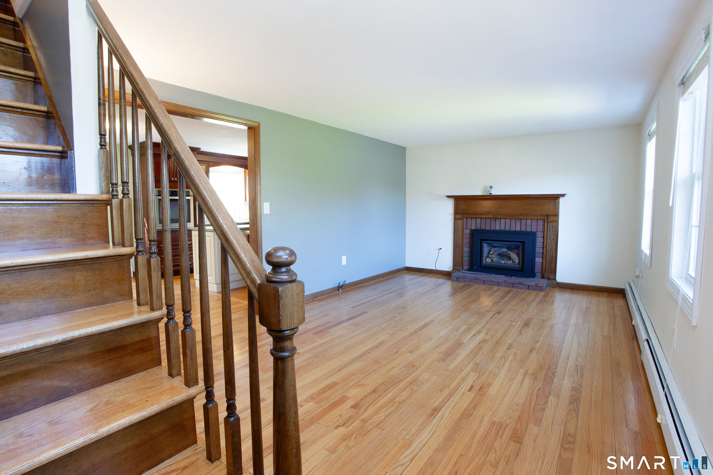 172 Weymouth Road Enfield, CT 06082 - Photo 24 of 35 View inside the front door to the living room and up the stairs to the bedroom level.