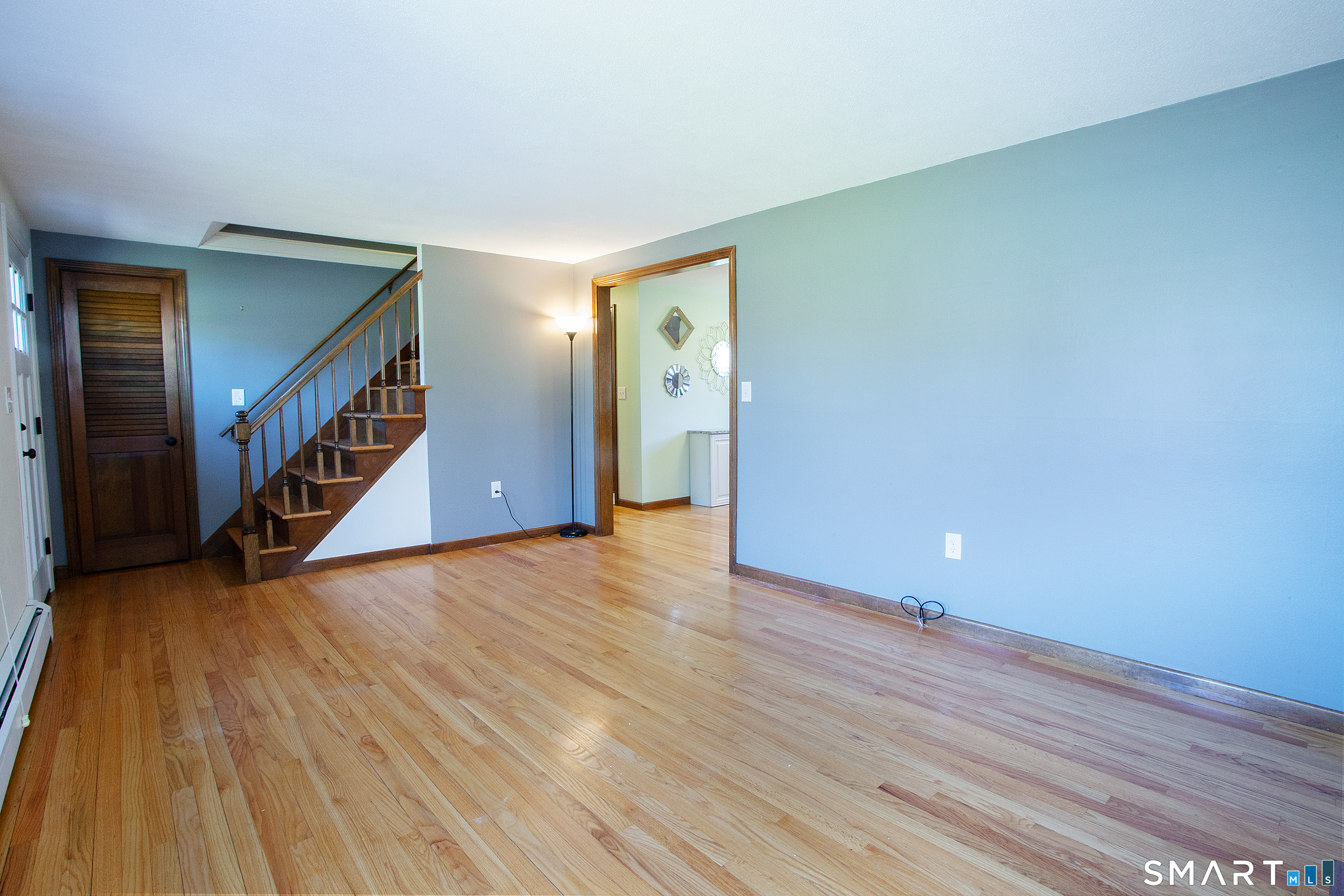 172 Weymouth Road Enfield, CT 06082 - Photo 6 of 35 Just step inside the front door & fall in love -- living room with fireplace and gleaming hardwood floors