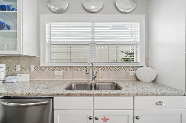 a view of a balcony with wooden floor and fence