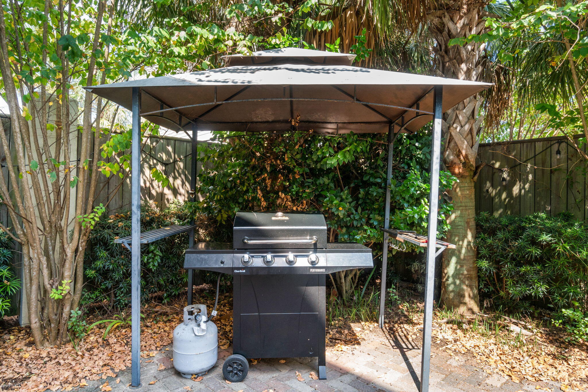 29 Payne Street Miramar Beach, FL 32550 - Photo 20 of 76 a view of a patio with table and chairs under an umbrella