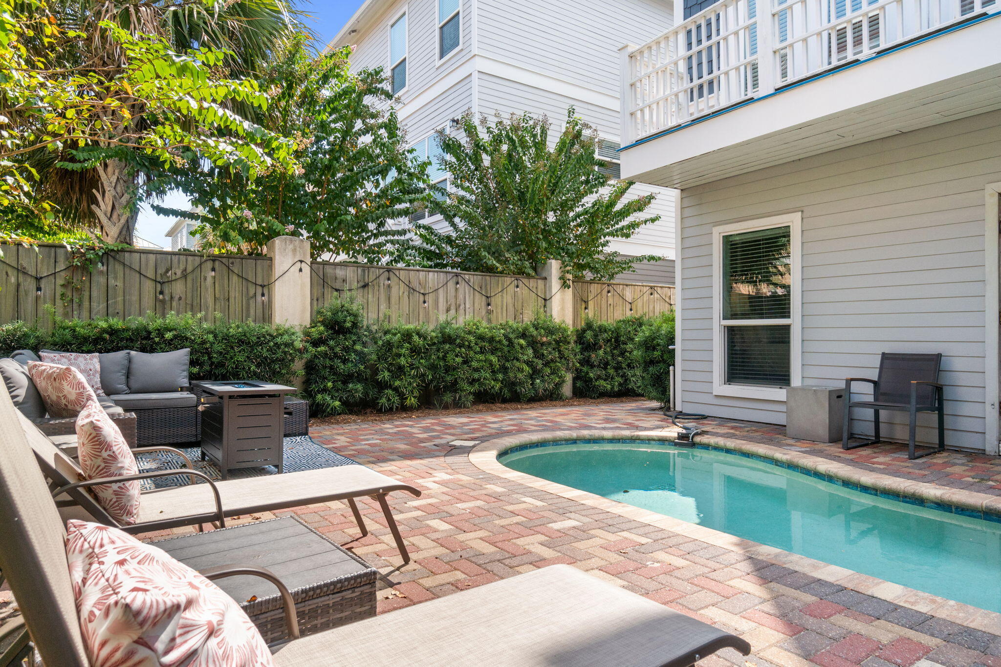 29 Payne Street Miramar Beach, FL 32550 - Photo 22 of 76 a view of backyard with swimming pool and furniture
