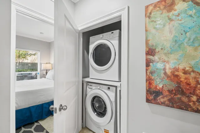 a spacious bedroom with a bed and a flat screen tv