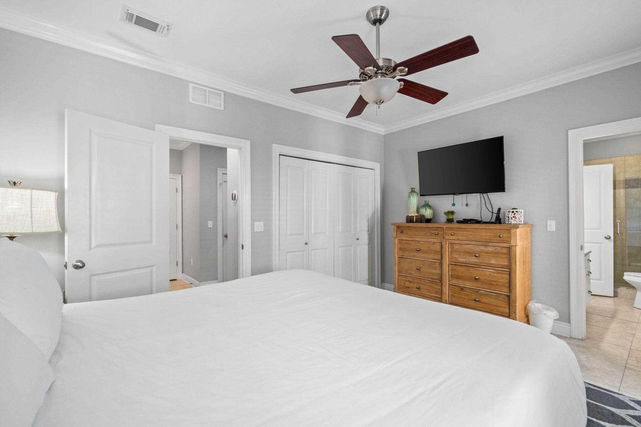 29 Payne Street Miramar Beach, FL 32550 - Photo 28 of 76 a bedroom with a bed and a flat tv screen on dresser