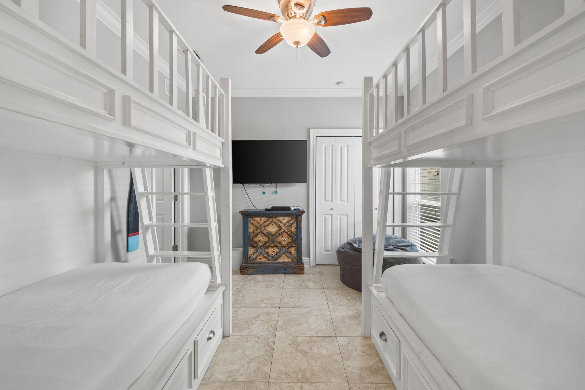 29 Payne Street Miramar Beach, FL 32550 - Photo 34 of 76 a spacious bedroom with a bed and a flat screen tv