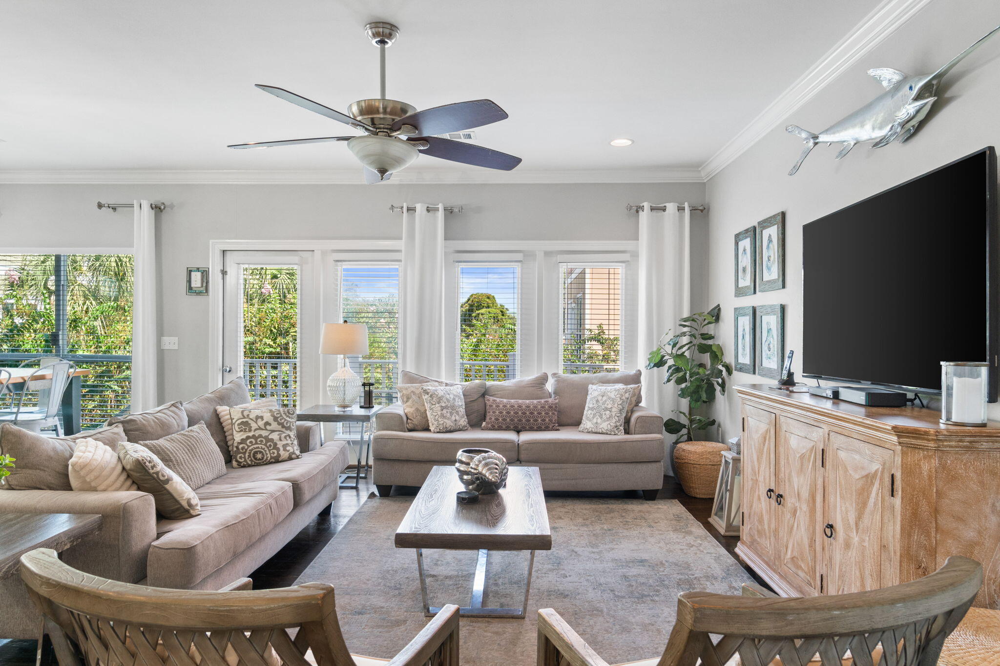 29 Payne Street Miramar Beach, FL 32550 - Photo 4 of 76 a living room with furniture and a flat screen tv