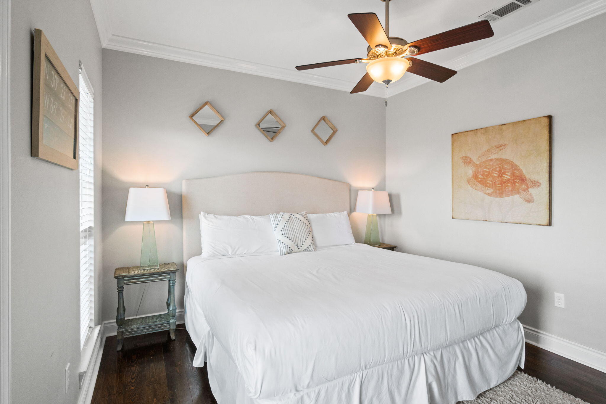 29 Payne Street Miramar Beach, FL 32550 - Photo 47 of 76 a bedroom with a bed and a chandelier