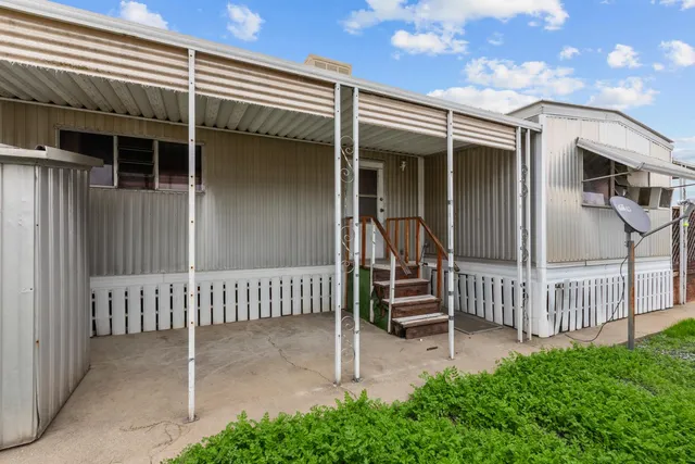 a view of a house with a fence