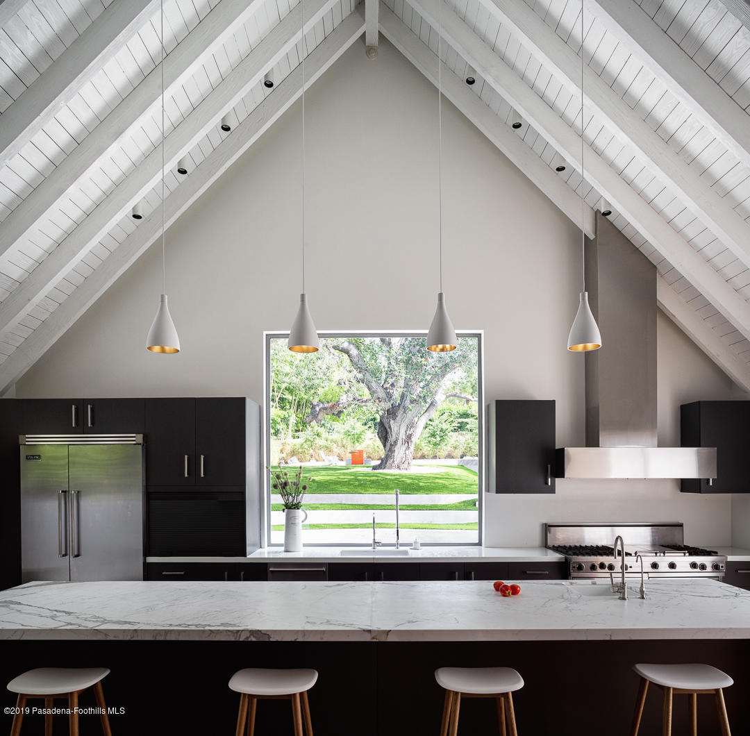 561 Woodland Road Pasadena, CA 91106 - Photo 13 of 41 a kitchen with a sink cabinets and window