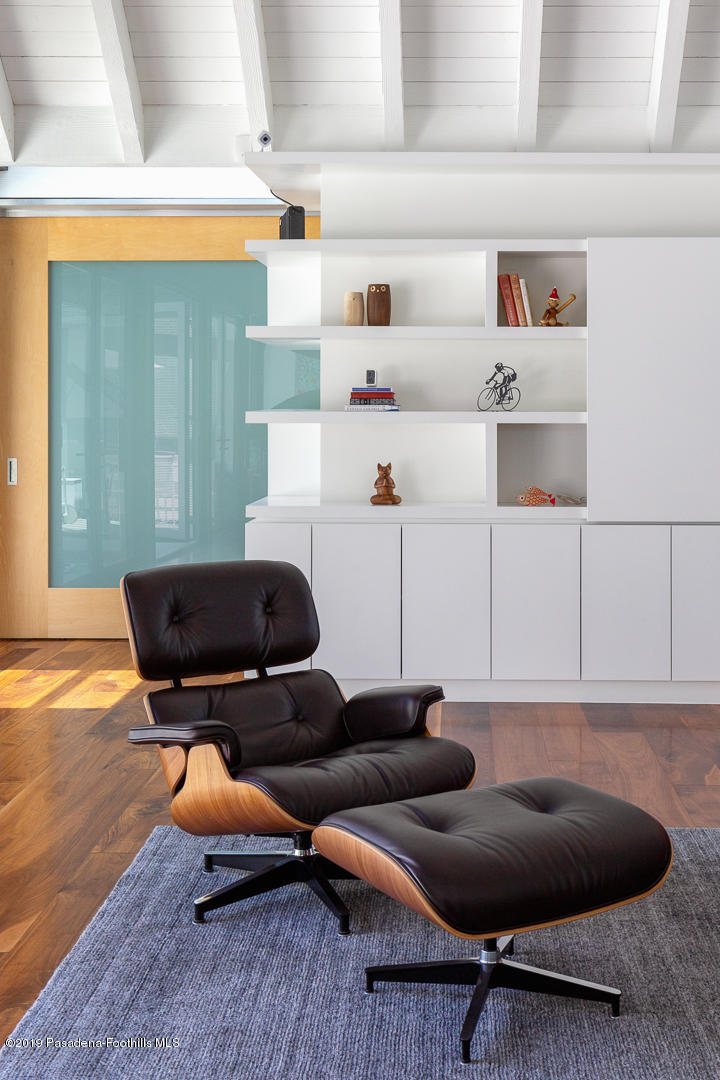 561 Woodland Road Pasadena, CA 91106 - Photo 19 of 41 a living room with furniture and a wooden floor