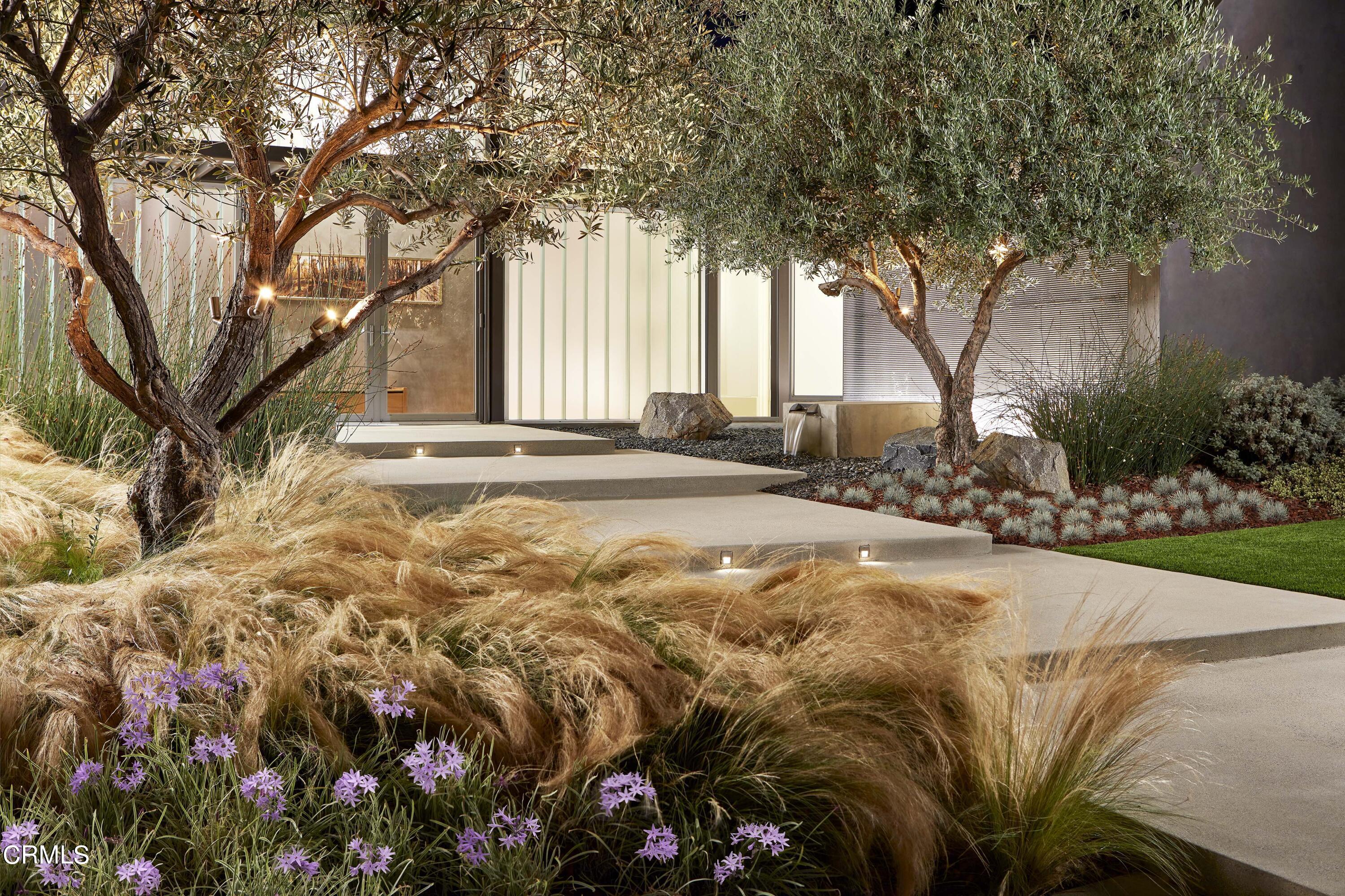 561 Woodland Road Pasadena, CA 91106 - Photo 2 of 41 a view of a yard with plants and trees