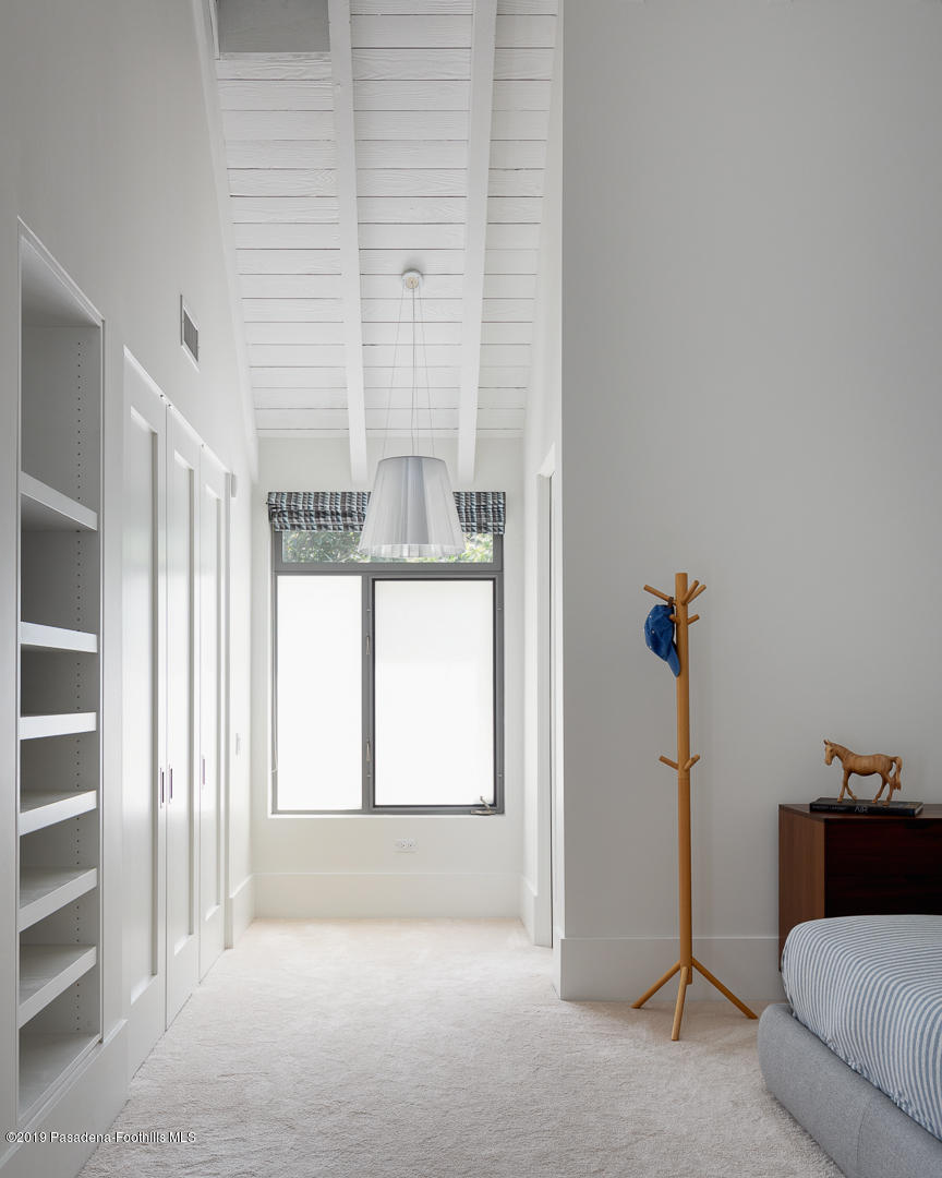 561 Woodland Road Pasadena, CA 91106 - Photo 21 of 41 a view of a livingroom with a couch and a window