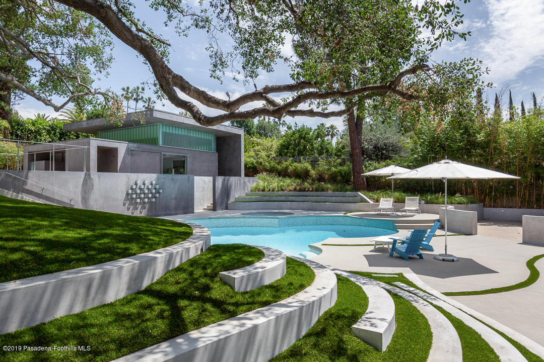561 Woodland Road Pasadena, CA 91106 - Photo 29 of 41 a swimming pool with outdoor seating yard and green space
