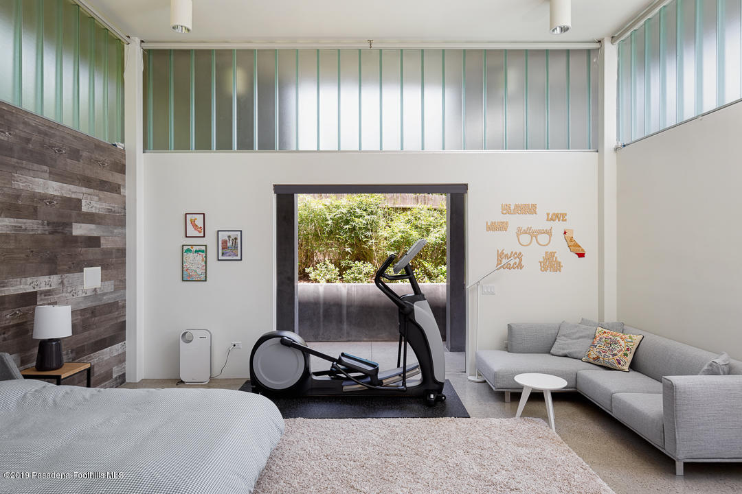 561 Woodland Road Pasadena, CA 91106 - Photo 31 of 41 a living room with furniture and a window