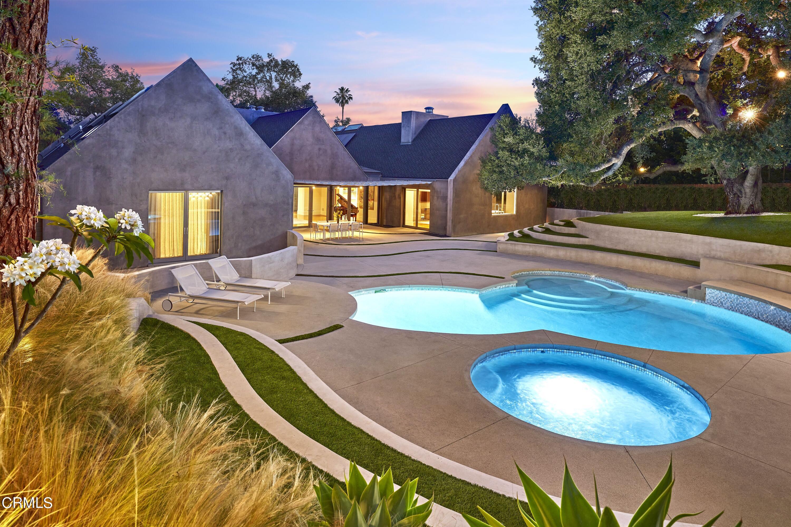 561 Woodland Road Pasadena, CA 91106 - Photo 36 of 41 a view of a swimming pool with a patio