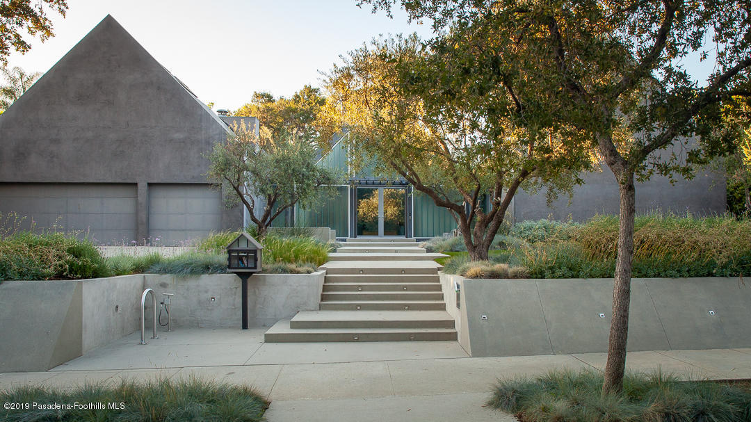 561 Woodland Road Pasadena, CA 91106 - Photo 4 of 41 a view of a house with a tree in front of it