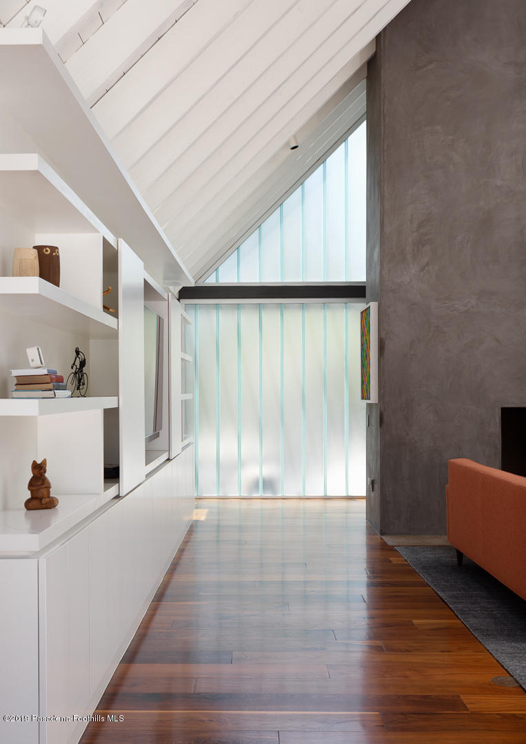 561 Woodland Road Pasadena, CA 91106 - Photo 7 of 41 a view of an empty room with wooden floor and a window