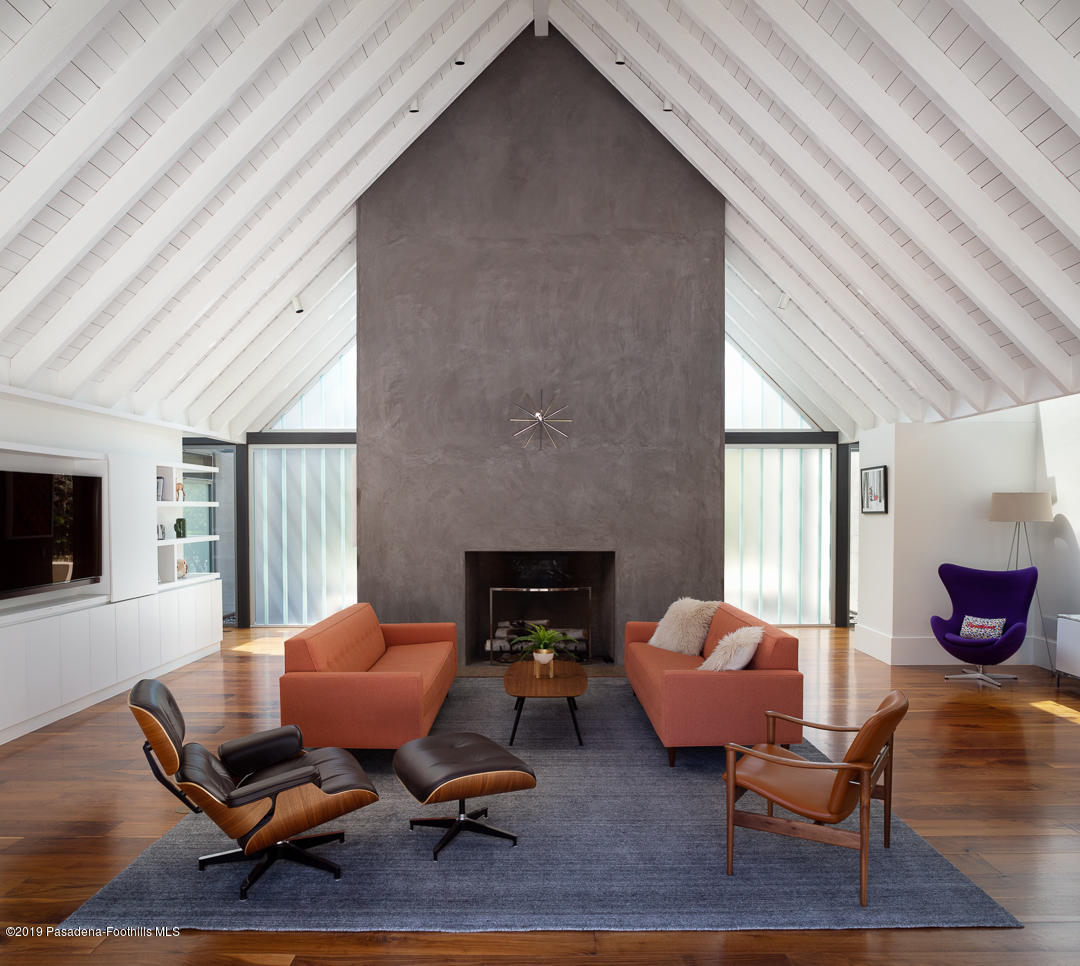 561 Woodland Road Pasadena, CA 91106 - Photo 8 of 41 a living room with furniture and a fireplace