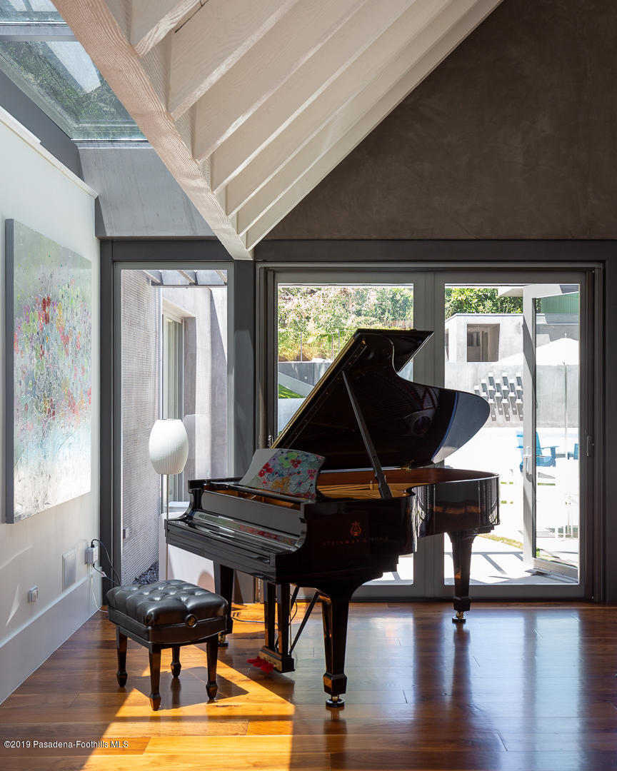 561 Woodland Road Pasadena, CA 91106 - Photo 9 of 41 a living room with furniture and a wooden floor