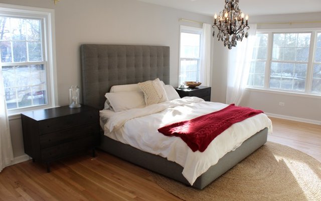 1720 Ridgewood Lane East Glenview, IL 60025 - Photo 13 of 24 a bedroom with a bed lamp and window
