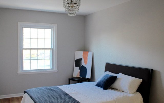 1720 Ridgewood Lane East Glenview, IL 60025 - Photo 17 of 24 a bedroom with a bed and a window