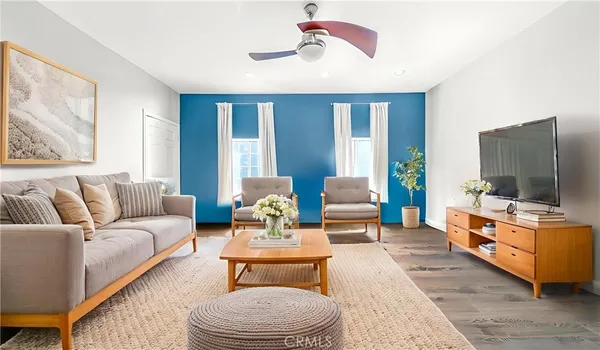 a living room with furniture and a flat screen tv