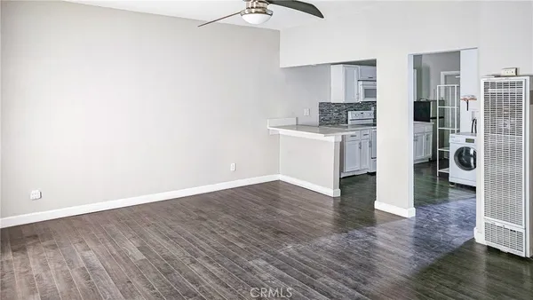 a view of kitchen and wooden floor