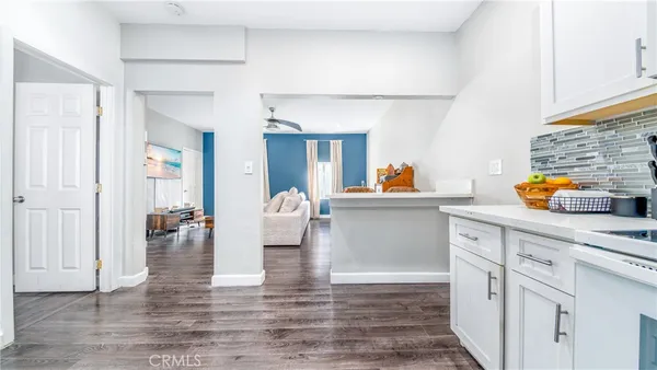 a kitchen with stainless steel appliances granite countertop a sink and cabinets