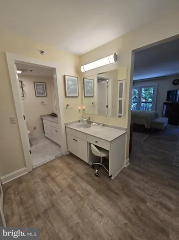 a room with a bed and furniture