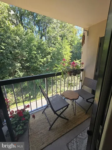 a view of balcony with furniture
