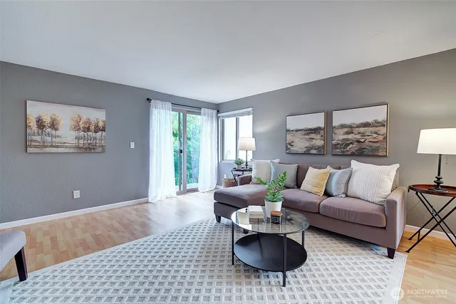 a living room with furniture and a rug