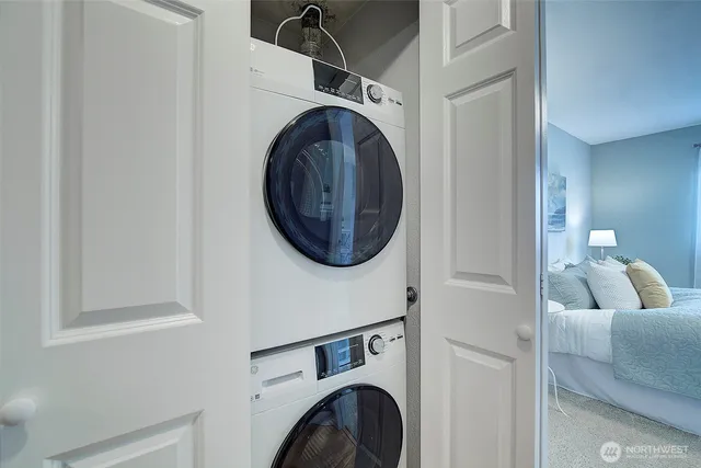 a view of livingroom with washer and dryer