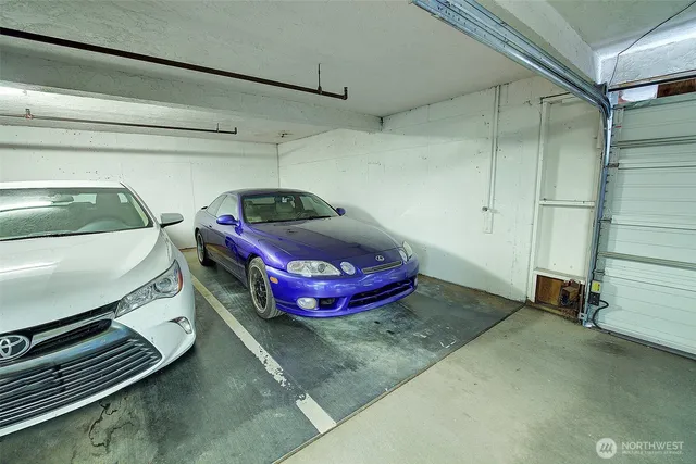 a room with a bed and gym equipment