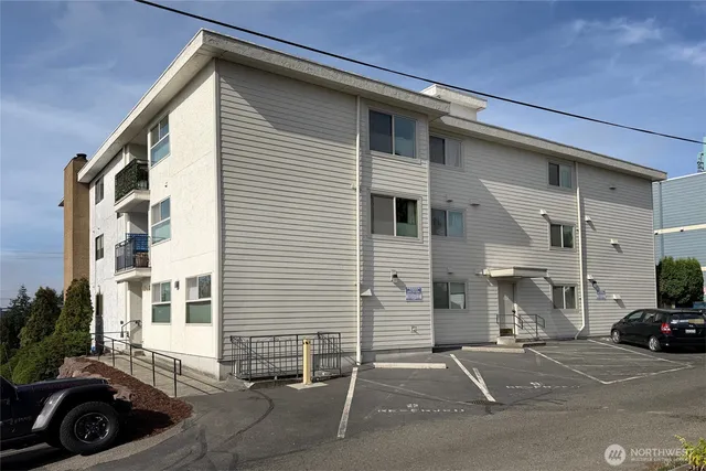 a view of a car park in front of house
