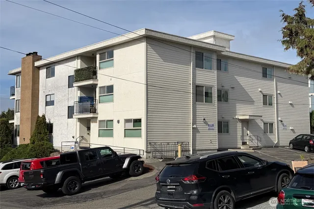 a view of a car parked in front of a house