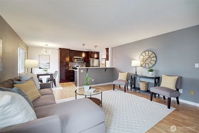 a living room with furniture and a table